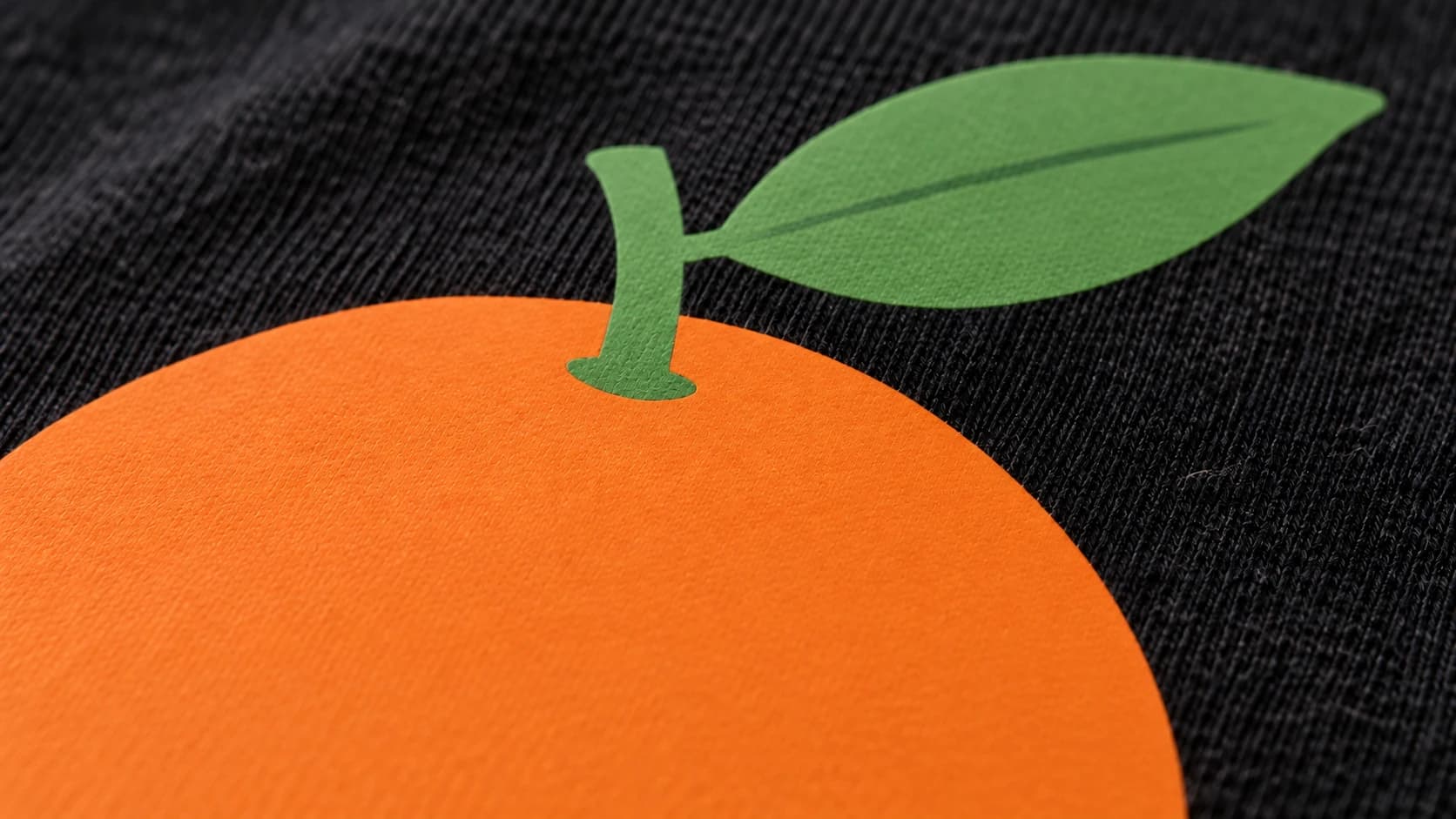 Thin orange and green heat-transfer vinyl on the black shirt