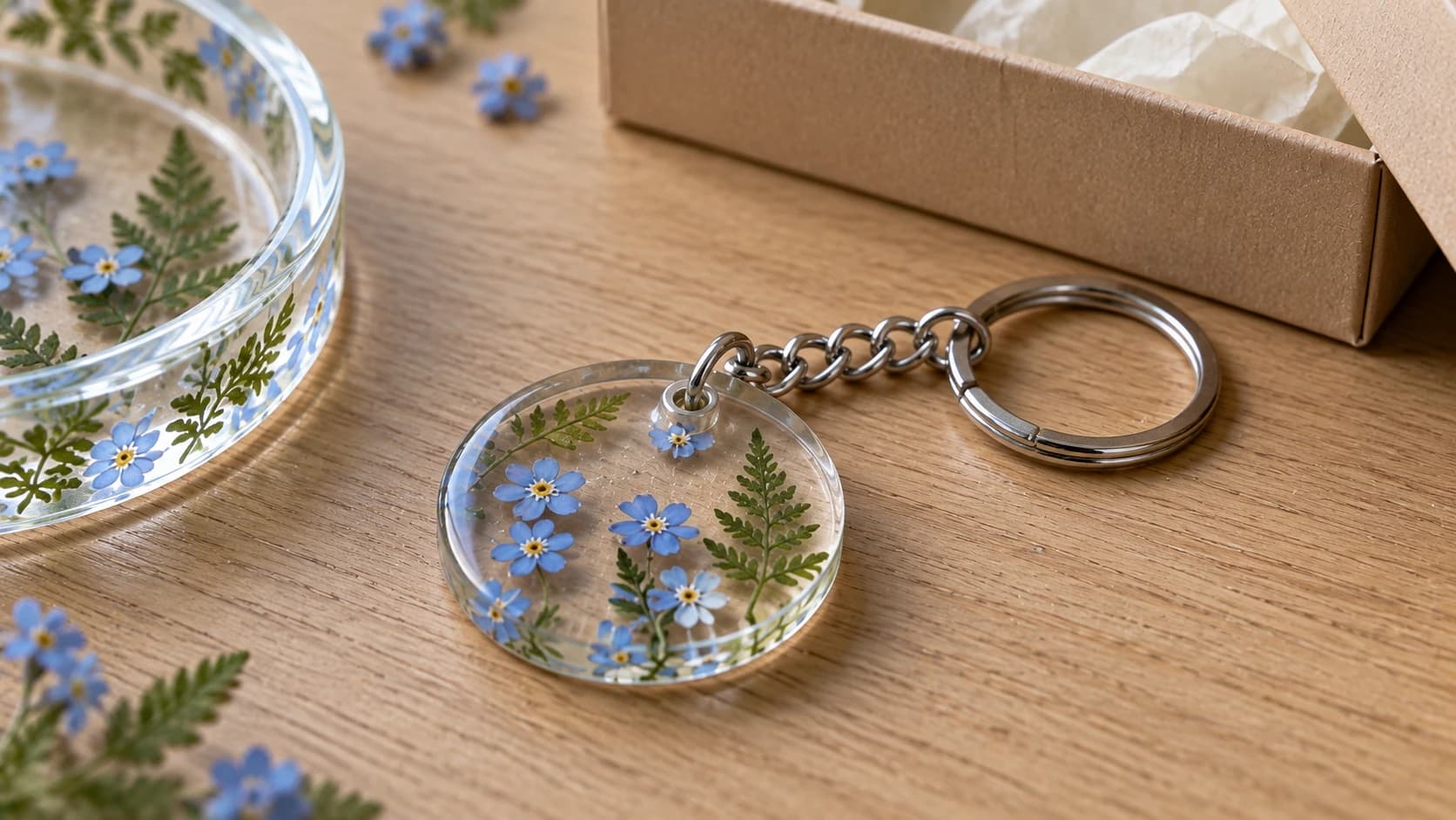 Blue flower resin keychain with a metal-lined hanging hole, connecting ring, short chain and split key ring